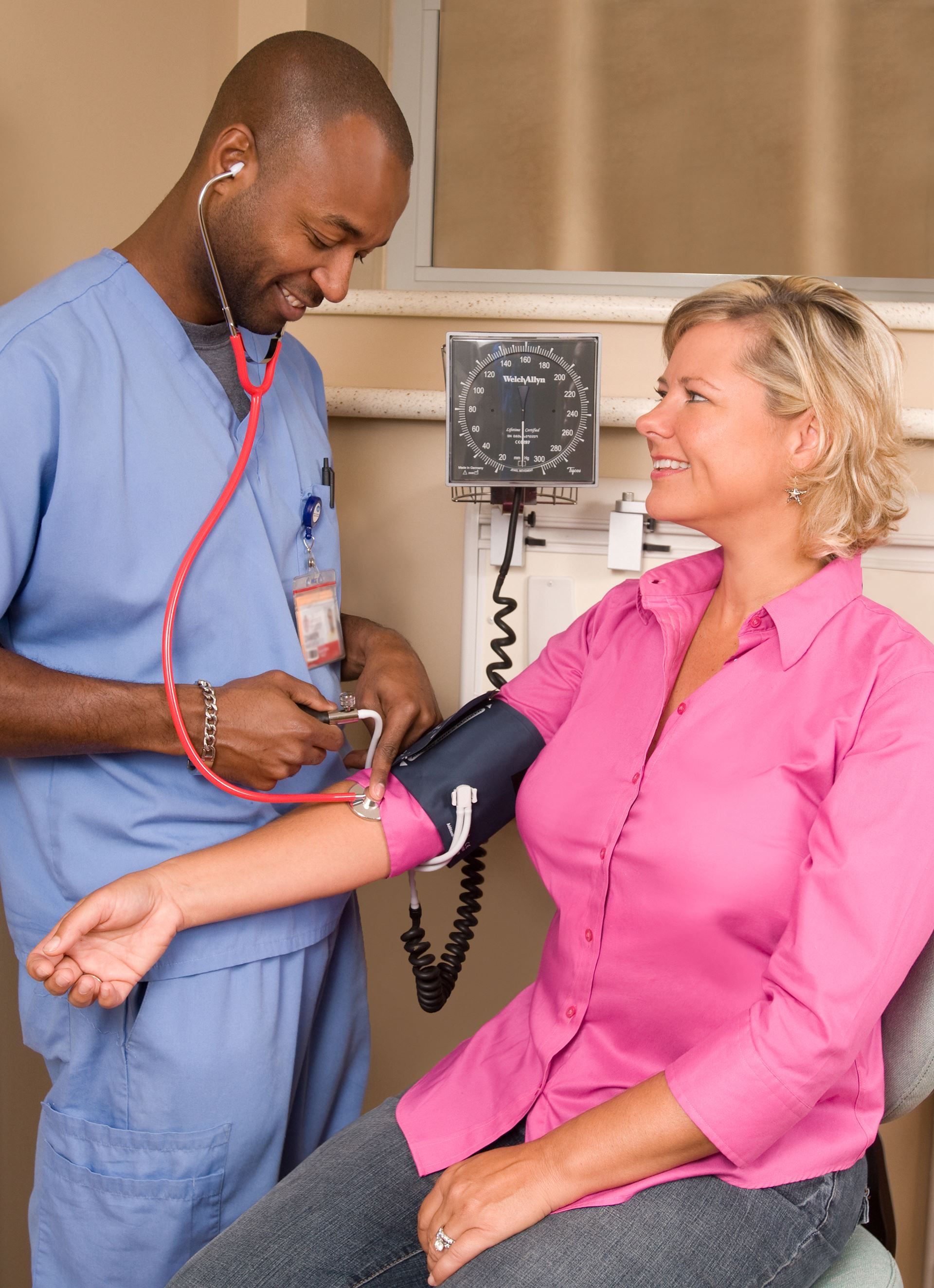 Nurse taking patient BP